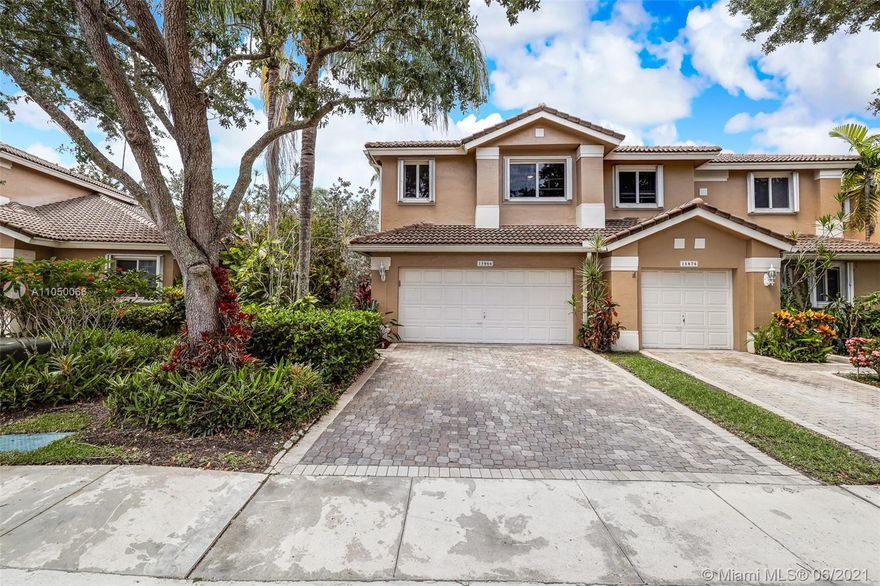 Beautiful & rare corner unit on a cul-de-sac street. Tastefully upgraded 3 Bedrooms 2 1/2 Baths, in the highly desirable Golf Community of Grand Palms in Pembroke Pines. The pictures says it all, move in ready. Lots of natural light, with vaulted ceilings in the living/dining area which opens up to a large & lush backyard with fruit tree. Large Kitchen with Granite Countertops, 42" Maple Wood Cabinets, Stainless Steel Appliances with laundry inside the home with updated half bath with large 2 car garage and porcelain tiled first floor. Second floor features porcelain wood look tile floor with large master bedroom, gorgeous master bath with marble countertop with natural stone walk in shower. Two other bedrooms with ample closet space.