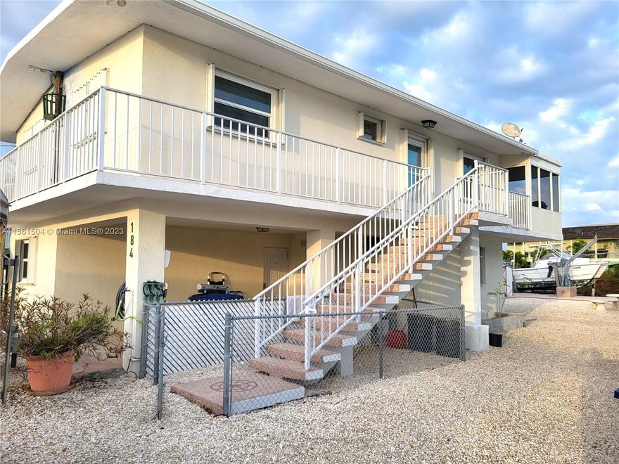Live where you can play! This CBS-constructed home offers you the Florida Keys living at its best. Easy ocean and bay access. From this canal, the waters lead through John Pennekamp Coral Reef State Park to the ocean or the bay. You'llfind this to be an excellent area for kayaking and paddle boarding. The home's construction is just what you are looking for, CBS construction with a concrete roof. The home has 2 bedrooms, a bathroom room upstairs, a great 1st-floor area, and a wine room. Enjoy the outdoors, swim in the aboveground pool, and bring all your toys because there is plenty of parking for your cars, boats, and water toys. Bring your boats and make use of the 50' concrete dock with a 14,000 lb boat lift. From here, you have easy access to the mainland and all the Upper Keys offers.