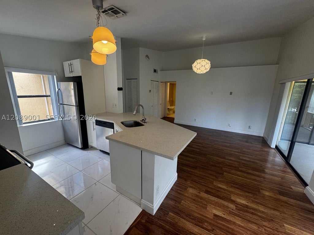 Photo of 9999 Summerbreeze Dr #212, Sunrise, FL 33322 (MLS # A12089001)