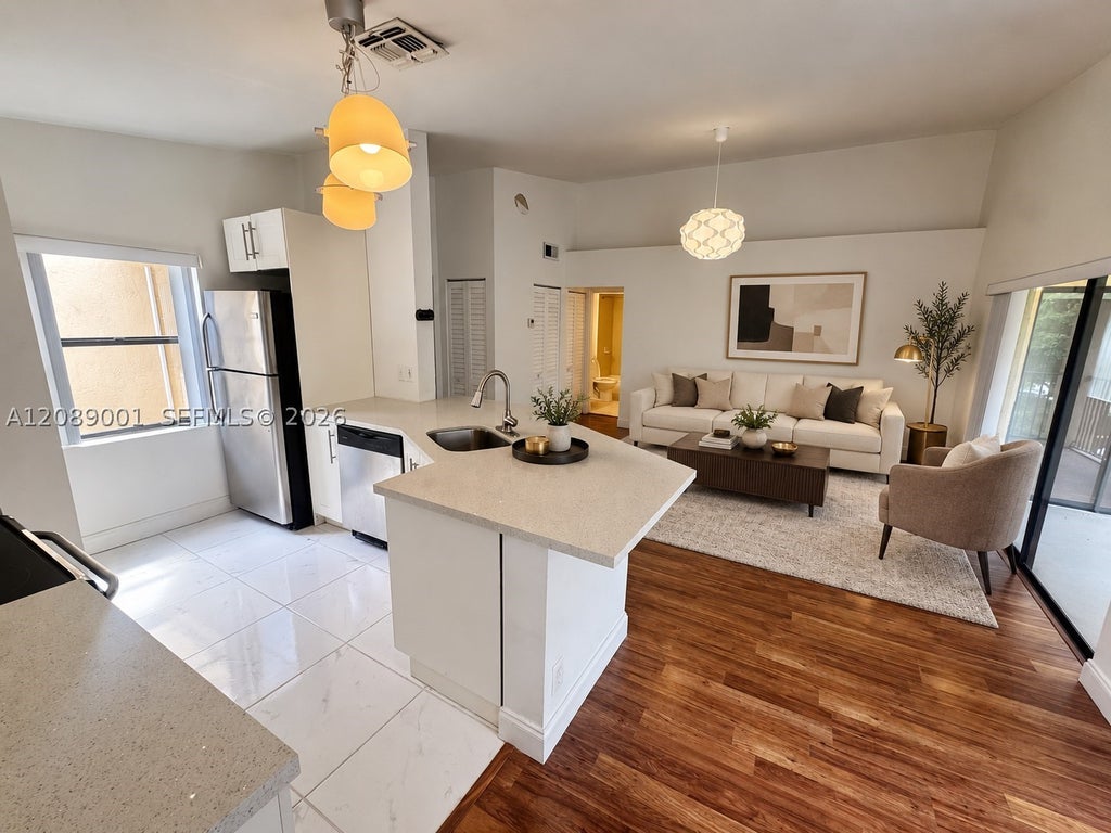 Photo of 9999 Summerbreeze Dr #212, Sunrise, FL 33322 (MLS # A12089001)
