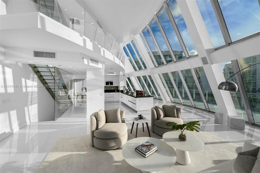 Modern Cutting-Edge Penthouse in the prestigious Artech Aventura. This architectural masterpiece is the only unit with 116' private dock for your vessel. Discover a beautiful 5 bedroom and 5/1-bathroom condo offering impressive floor to ceiling panoramic impact windows with gorgeous intercoastel/ocean views. Enter through the second level and find an open formal living room and kitchen w/ Subzero and Miele appl, formal dining and large junior suite with sitting rm/office. Glass staircase takes you to first level which offers 2 en-suite bedrooms and on the third level find a spacious loft area, master suite with sitting room/office and an additional bedroom. Fourth level offers a private roof top terrace/sun deck. State of the art amenities including valet, tennis court, 24hr/sec, etc…