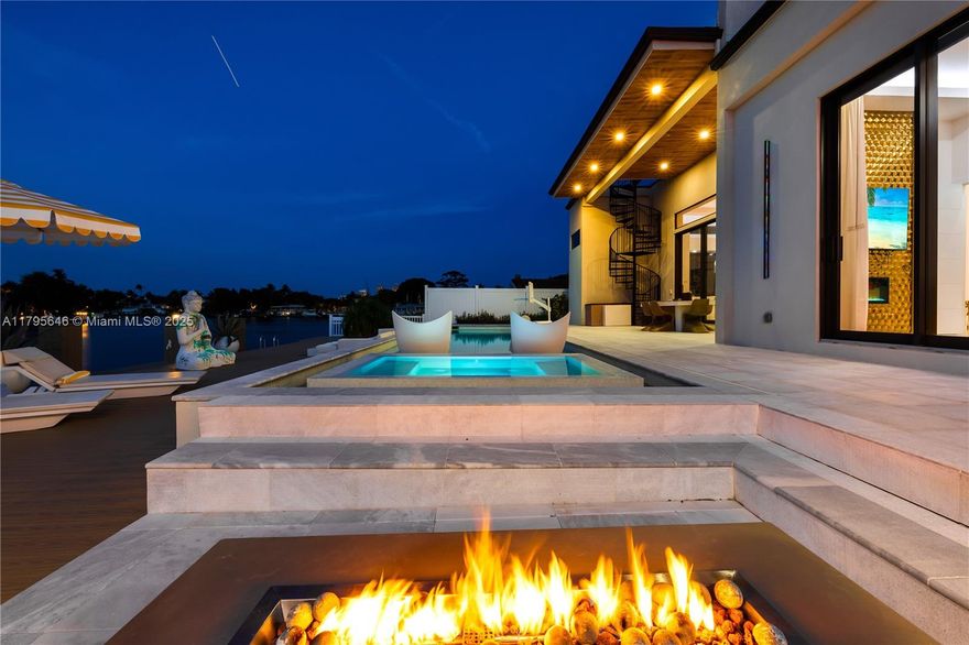 Spectacular waterfront residence with ultra-high end finishes and upgraded design and appliances. The backyard features a California kitchen, large dock, jacuzzi, heated pool and views for miles. This home features exquisite artwork, furnished interiors with modern decor. this gated neighborhood is near the beach and has stunning views of the Fort Lauderdale area.