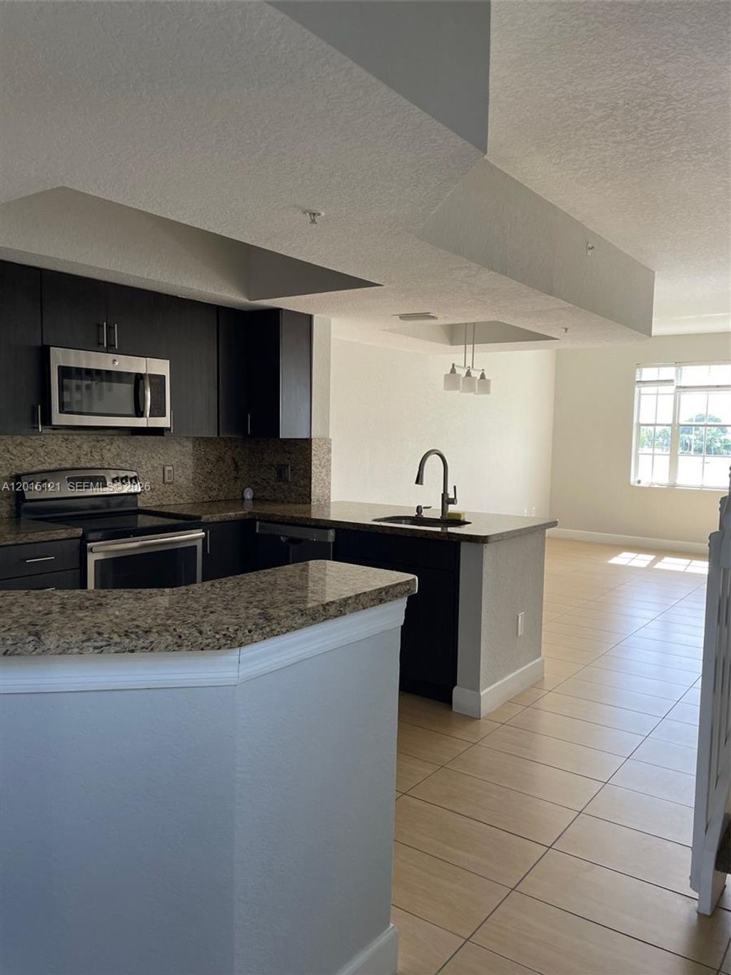 Photo of 711 SW 148th Ave #414, Sunrise, FL 33325 (MLS # A12015121)