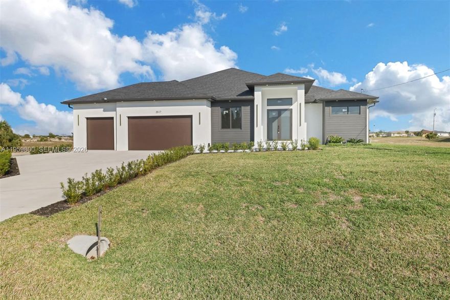 SELLER WILL CONTRIBUTE $30,000.00 TOWARDS BUYER'S CLOSING COSTS! Discover the epitome of modern luxury at 3517 NW 46th Ave, Cape Coral, FL 33993, where smart home technology meets exquisite design. This home features Alexa integration through ceiling speakers, allowing seamless control of your environment, and showcases imported Spanish wood bathroom cabinets for a touch of elegance. The living room is adorned with a modern wooden TV wall and a fireplace, while the master bedroom offers its own cozy retreat with another fireplace. The interior boasts expansive 36"x36" floor tiles, extra-high ceilings, and grand 96" doors, contributing to an open, luxurious feel. The kitchen is a chef's delight with 100 wood cabinets and high-end appliances, including a washer and dryer. Outside, marble tiles enhance the front and back yard, leading to two Entertainment areas - a terrace and BBQ space, both equipped with ceiling fans for year-round comfort. The property also includes a triple garage with an insulated door and epoxy flooring, ensuring ample space for your vehicles or hobbies. The pool area is secured by a complete fence, featuring smart Pentair equipment manageable via phone, heated by a Rheem pool heater for continuous enjoyment. Situated on a .28-acre lot, this home blends technology, comfort, and style into one impeccable living experience.