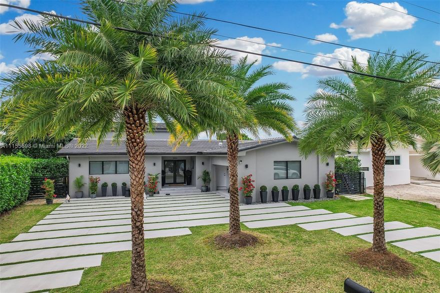 Modern and bright water front home located in the upscale gated community of Sans Souci Estates. Dock can fit a 70ft yacht with direct access to the bay. All renovated with attention to details, impact windows, beautiful wood work and touches designed by well known and talented Brazilian designer Lu Marinho. 2  new AC's (2021), NEW ROOF (2021), refinished deck (2021). Great and quiet neighborhood 5 minutes from beaches and the famous Bal Harbour Shops and 10 minutes from Design District and Aventura Mall. Whole Foods and Publix right around the corner.