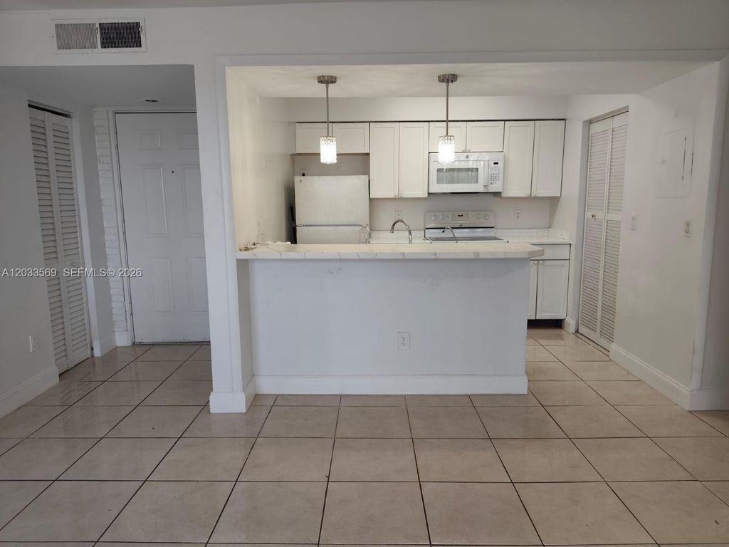 Photo of 1269 SW 46th Ave #2408, Pompano Beach, FL 33069 (MLS # A12033569)