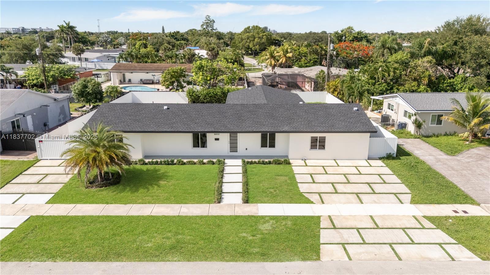 Newly rebuilt home up-to-date with Miami-Dade Building Code, including new plumbing, roof, electrical, etc. Conveniently close to Zoo Miami, Publix, top-rated schools, restaurants, Palmetto Expressway and the Florida Turnpike. Open concept living space flooded with natural light, featuring pocket glass doors that fully open to outdoor pool area. State-of-the-art kitchen with stainless steel appliances, quartz countertops, custom cabinetry, and a generous island. An adjacent butler’s pantry and laundry room has plenty of additional cabinets and dedicated space for an additional refrigerator. The primary suite features a luxurious en-suite bathroom with dual vanities and glass-enclosed shower with soaking tub. Pre-wired for security cameras and plumbing for an outdoor kitchen is in place.
