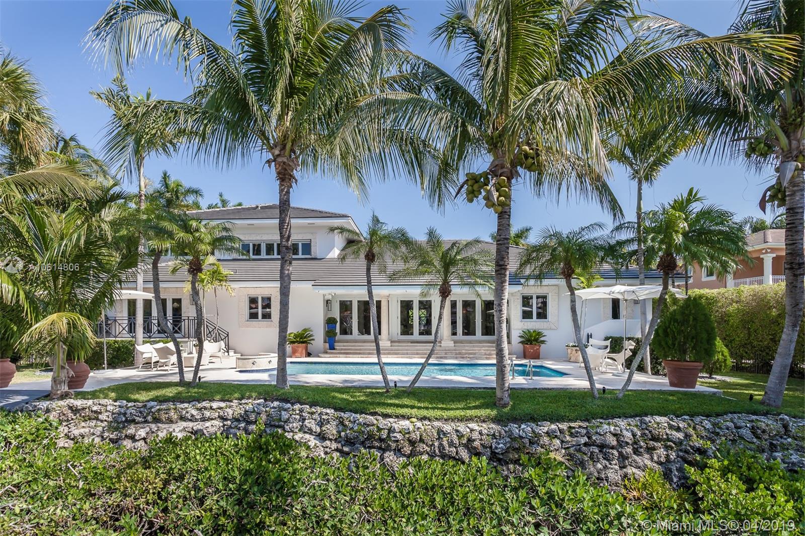 In the beautiful guard gated community of Cocoplum, this magnificent 5338 sq ft 5 bed/4.5 bath lies on 120 ft of waterfront. The sophisticated residence features exquisite marble floors throughout, crown molding, and expansive living room with French doors bringing abundant natural light. The family room comes with a wine cellar and leads to the gourmet kitchen with cooking island, Thermador gas range, subzero refrigerator and freezer, custom built-ins and beautiful granite countertops. The elegant master suite occupies the entire second floor of the home, features a spacious sitting area, en suite bathroom with separate tub and shower and large walk in closets. An outdoor retreat with patio, a pool and 70 ft dock makes this property a boaters dream.
