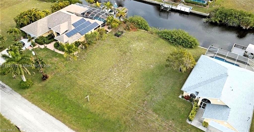 Build your dream home on this 10,018 sqft lot with Gulf access in Unit 59 of Cape Coral. No HOA. City water/sewer coming in 2025, cost added to taxes. 9-ft bridge to Gulf. High-value area near Matlacha, Pine Island, Sanibel, and Fort Myers Airport. Ideal for a private dock and fishing from your backyard. Surrounded by new homes, close to shopping, dining, and golf. Don’t miss this investment opportunity! "Best Location"
