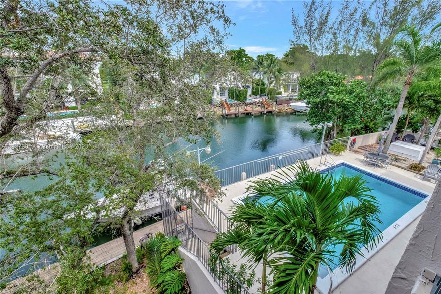 Discover unrivaled waterfront vistas on the Coral Gables Waterway from this stunning penthouse. Located east of US1, every room reveals tranquil water panoramas, enhanced by a spacious balcony. Modern vaulted wood ceilings breathe life and style into the space. Enjoy utmost privacy with the smart split-plan design. Benefit from a near-new AC system, an efficient washer and dryer (just a year old), and tandem parking in a secure garage. The building boasts a picturesque waterside pool and a versatile meeting room. With quick access to the University of Miami, Merrick Park shopping, and Miami Metrorail, luxury meets convenience. Schedule a tour and dive into the pinnacle of waterfront opulence.
