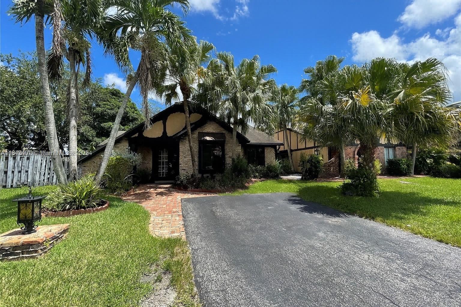 Beautifully maintained and thoughtfully designed, this home features 3 spacious bedrooms, 2 updated bathrooms, and 2 flexible additional rooms ideal for a home office, den, or oversized laundry area. Elegant tile flooring flows throughout, leading to a grand living room with vaulted ceilings and exposed beams. A striking atrium brings in abundant natural light, enhancing the open layout. The gourmet kitchen boasts granite countertops, custom cabinetry, and premium stainless steel appliances. Outside, enjoy a charming Chicago brick patio and a large, fenced wraparound yard perfect for entertaining. Situated in a highly desirable neighborhood offering both privacy and convenience. Don’t miss your chance to see it—schedule your showing today!