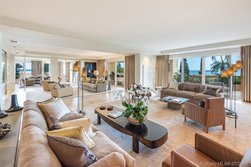 This ground floor Southwest corner unit sits on Fisher Island’s most coveted location w/unobstructed Miami skyline sunset views & views to Biscayne Bay & Atlantic Ocean. Features an expansive 2,000 SF wraparound terrace with total privacy. Feels like you are living in a private residence. Spacious open living room w/fireplace & fine Travertine marble floors throughout, family room, private dining area, gourmet kitchen w/Carrera marble center island/backsplash & separate breakfast area. The private master suite features a large office space, fireplace, terrace access & stunning custom designed master bath w/extraordinary closets spaces, Carrera marble shower & cast iron tub. The 3 other bedrooms are each spacious with en-suite bathrooms. 5-Star Fisher amenities complete this offering.