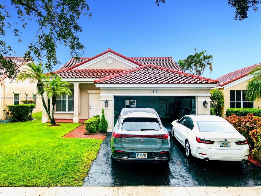 Weston Updated & Move-In READY home in the gated community of The Falls!! Modern home with an Open Concept kitchen with lots of lights, modern with quartz countertops and stainless appliances. Renovations include a New ROOF in 2021, NEW smart AC, updated bathrooms with showers and master bath with free standing tub also. Accordion shutters and electric garage door. The patio is spacious and has the screen with a nice view to the lake and beautiful landscaping.  Zoned for A-rated schools and minutes from major highways, shopping, and dining; Low HOA fees. This community has pool, park and more. Excellent location!!!