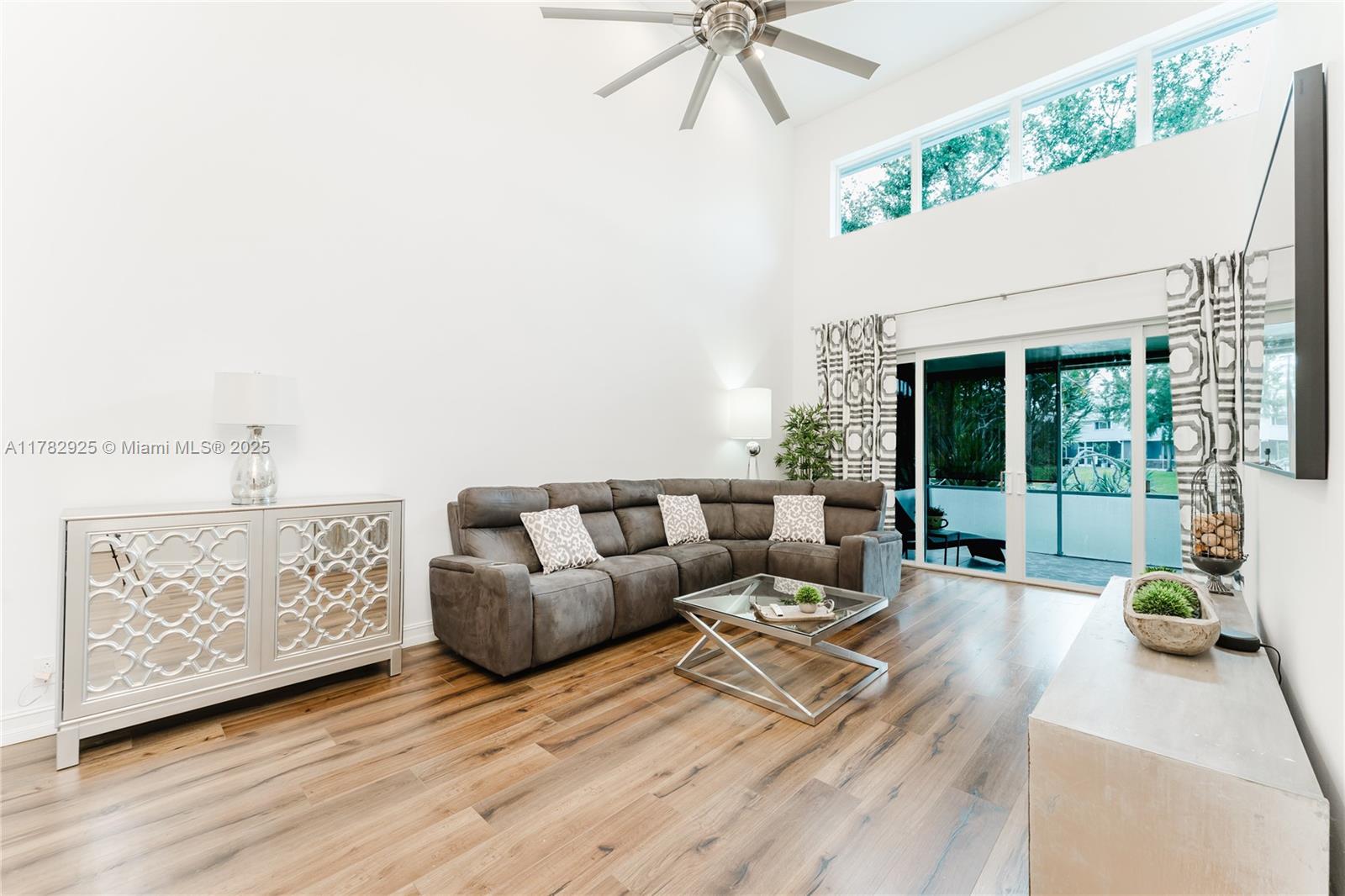 Discover this stunning waterfront end-unit townhome in Boca Del Mar’s private Boca Park community. Updated and well maintained from ceilings to floors, this 3-bedroom, 2.5-bath residence features soaring 18 ft ceilings, white shaker cabinets with granite countertops in kitchen and baths, stainless appliances, and luxury wood-finish flooring-no carpets! Impact windows and doors. Roof replaced in 2022. Enjoy a 1-car attached garage and serene lake views. This pet-friendly, all-ages community’s HOA covers building insurance, roof maintenance, water, lawn care, and cable. Amenities include a lakeside pool and spa, clubhouse, tennis courts. Minutes from Boca Town Center Mall and top schools. Schedule your tour today!