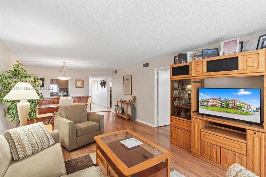 This spacious 2-bedroom, 2-bathroom condo is located on a convenient first floor of the vibrant 55+ community of Hollybrook Golf & Tennis Club. Enjoy exceptional and relaxing courtyard views from your balcony. The home features a spacious kitchen and remodeled bathrooms with a blended combination of ceramic tiles and laminate floors. Residents enjoy a wealth of amenities, including golf courses (cart fee applies), several pools, pickleball, tennis, restaurant, billiard room, BBQ/picnic area, clubhouse, courtesy bus, exercise room, heated pool, library, sauna, shuffleboard, and much more! The community is ideally situated close to shopping, dining, and easy access to the highways. This is a must-see opportunity for those seeking a tranquil environment or an active and engaging lifestyle.
