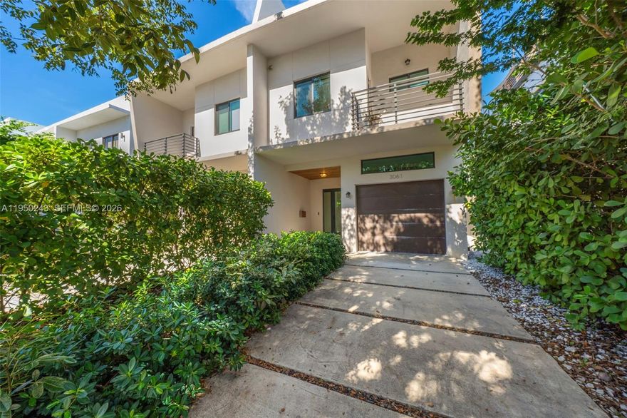 Discover elevated urban living in this turnkey townhouse completed in 2021. Offering 3 bedrooms, 3 full en-suite baths, and 2 half baths, the home features a seamless open-concept layout and a sleek modern kitchen with a waterfall island. Thoughtful upgrades include solid wood doors with hidden hinges, electronic shades, custom walk-in closets, linear A/C vents, and abundant natural light throughout. Enjoy two private outdoor retreats: a turfed ground-level yard and a full-length rooftop deck with a private pool, wet bar and half bath—perfect for entertaining with city and sunset views. Additional highlights include a one-car garage and a spacious second-floor laundry room with side-by-side washer/dryer and storage. Ideally located one block from Coral Way and minutes from Miracle Mile, Giralda Plaza, the Plaza and the best of Coral Gables dining and shopping.