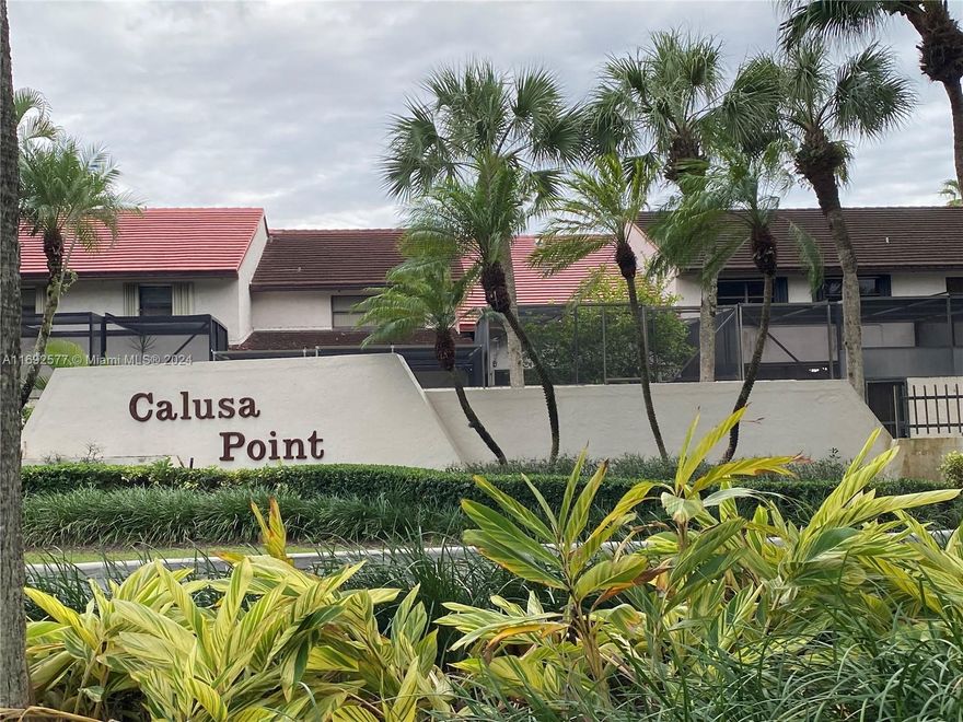 Stunning, completely remodeled Townhouse, stainless steel appliances, quartz countertops, modern finishes with a spacious layout perfect for families, Impact windows and doors. A/C new from 2023, plus an electric car charger installed.  This home is situated in the wonderful gated and secured community of Calusa Point,  with excellent amenities.  Near Turnpike, Highways, A+ Schools.