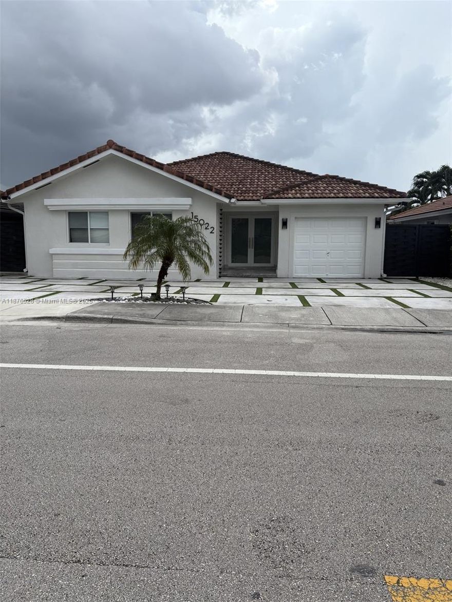 Completely renovated, located in a family-friendly neighborhood! One-story home 3/2 plus 1/1 efficiency with private entrance, perfect for guests or extra income. Modern open-concept kitchen with central island and SS appliances, spacious family room. Impact French doors & windows, updated bathrooms with granite finishes and modern mirrors, porcelain floors. Resort-style backyard with pool & jacuzzi with marble deck and electric heater, modern terrace with outdoor kitchen, and white travertine tile throughout the patio. No HOA!