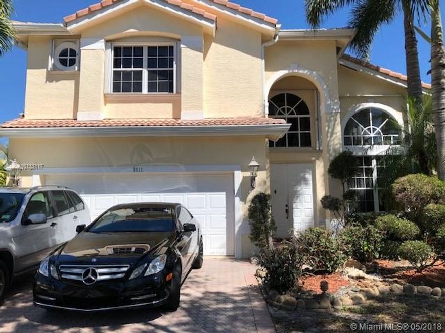 Spacious & open 2 story home, famous Savoy model in gated community.  Home features 4 bedrooms 4 bath, w/high ceilings, Remodeled open Kitchen w/stainless steel appliances & wooden cabinets, Tile flooring throughout, crown molding, separate utility/laundry room. One bedroom in main level floor. Back patio w/ sun blocker screens (custom made) pool & jacuzzi with heater remote control.  New A/C, New pool pump, accordion shutters, fruit trees, Club House, gym, picnic area, 24/7 security & much more.  Easy to show.