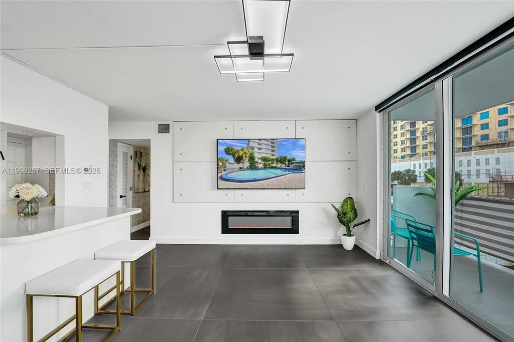 Photo of 430 Golden Isles Dr #201, Hallandale Beach, FL 33009 (MLS # A11988267)