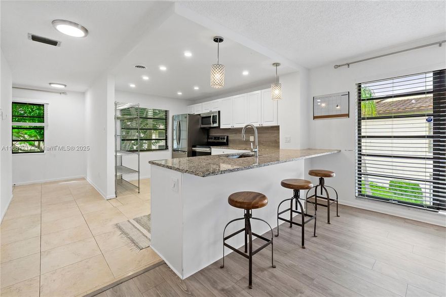Owner says SELL! This beautifully updated second-floor corner condo features 2 bedrooms and 2 bathrooms, both upgraded with modern finishes. Enjoy stylish flooring, a modern open-style kitchen with marble countertops, modern cabinetry, and appliances. The spacious, light-filled living area offers tranquil water & golf course views . A washer and dryer are also included for your convenience. With amenities like a pool and clubhouse, and close proximity to shopping and dining, this is the perfect spot for relaxed, convenient living. One reserved car space, ample guest parking, and a securely guarded entry complete the package. Optional membership to the Boca Lago Club is available, offering golf, tennis, and social events (not required).