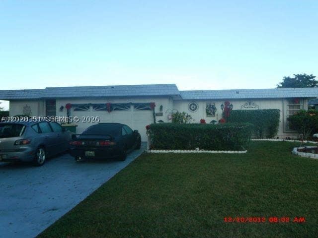 Photo of 6311 NW 71st Ave, Tamarac, FL 33321 (MLS # A12028351)
