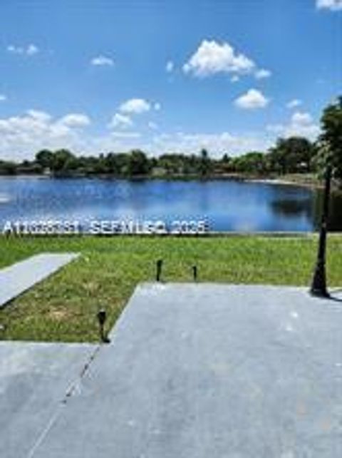Photo of 6311 NW 71st Ave, Tamarac, FL 33321 (MLS # A12028351)