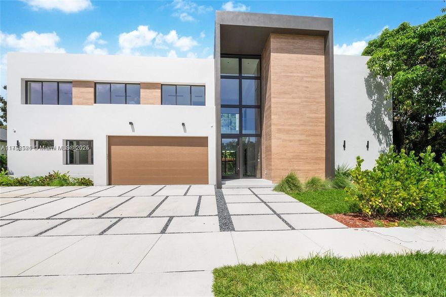 NEW CONSTRUCTION, AMAZING OPORTUNITY, READY TO MOVE IN!
7 Bedroom, 7.5 Bathroom, 2 Car Garage, a Real MASTERPIECE in South Miami. 
Open floor plan, high ceilings covering 5,501 SqFt, with large impact door and windows that bathe the home with Natural light. Kitchen with top-tier stainless steel appliances and quartz countertops, is a Chef's dream. Outdoor kitchen, heated pool and large terrace welcome your friends, family and you to enjoy the Miami Lifestyle. 
Master suite features a lavish bathroom with soaking tub, a frameless glass shower, dual vanities and spectacular walk-in closet. 
Each bedroom is en-suite, ensuring privacy. The home is equipped with smart features, including the elevator. WELCOME TO YOUR DREAM HOME !!!