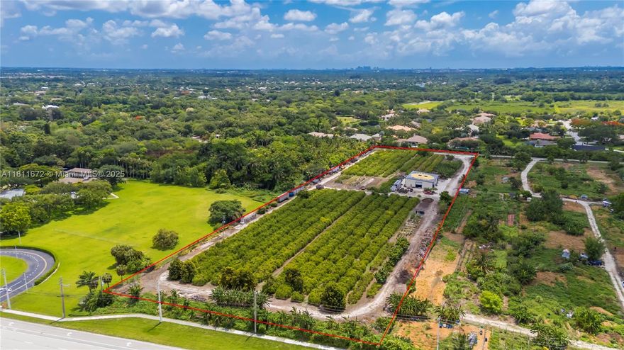 8.9 Acres! Unique property in Davie surrounded by million-dollar homes in a fast-growing, family-friendly area with "A" rated schools. Fronts Flamingo Rd, backs Flamingo Gardens, and borders the gated Ridge at Laurel Oaks. Fully fenced with gated access. Operating tropical fruit grove since 1987 with ~1,000 starfruit trees and other varieties (macadamia, avocado, banana, etc.). Features include a 5" well, advanced irrigation, very low ag taxes, and a 4,800 sf insulated steel building (Cat 5+ rated) with 1,140 sf A/C space, 2 kitchens, 2 baths, and 3 offices. Industrial features: mezzanine, 800A power, racking, security system. Includes prepped 1-acre homesite for a 4,000 sf home. Ideal for family compound, agribusiness, or investment. Agriculturally assessed, very low taxes.