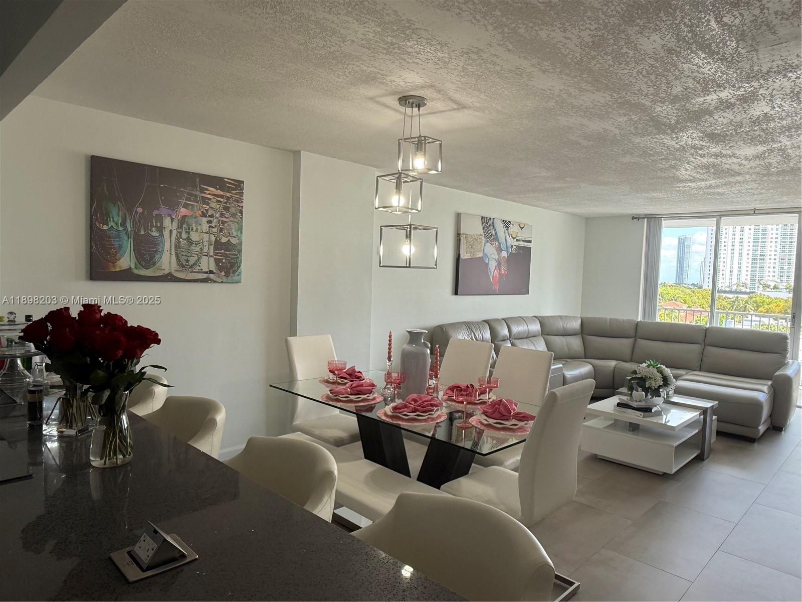 Modern Aventura condominium. The unit has been completely renovated. The apartment is flooded with natural light.  Features oversized living room with stunning views perfect for entertaining. Chef's kitchen with top of the line appliances. Beautiful tile floors and a spacious custom closet. Large master suite. Fully furnished and ready to move in!
Admiral's Port is a full service condominium with 24-hour guard, well stocked fitness center, library, pools, and much more. Great location near the beach, Aventura Mall and many great restaurants, shops and schools.
All the furniture is included in the sale. The existing couches included are the leather couches in the first two pictures. Stationary bike is not included.
****CALL LISTING AGENT TO ARRANGE SHOWINGS****