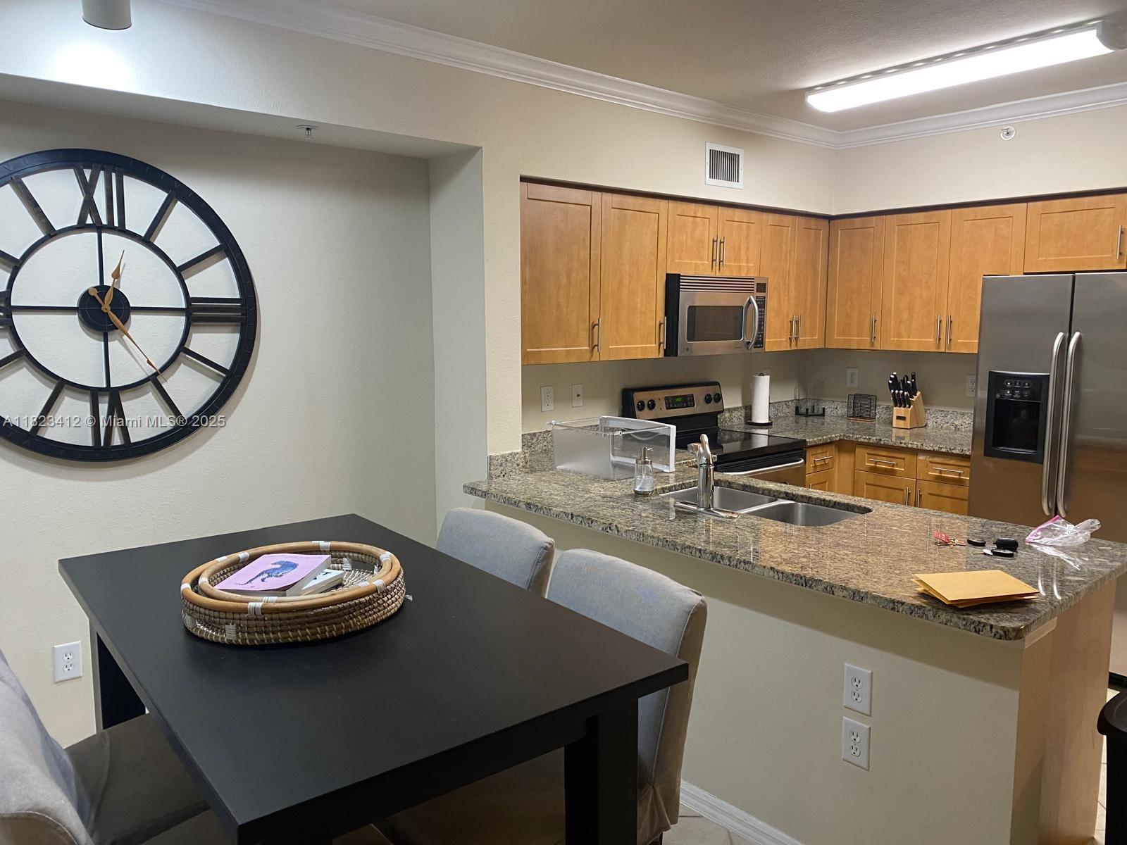 Great property, fully furnished apartment located just west of Florida’s Turnpike and 20 minutes from Downtown WPB. Gourmet kitchen with granite countertops and stainless steel appliances. Convenient full-size laundry room. Two parking spots. This meticulously maintained community offers resort-style amenities: two pools, tennis courts, and a luxurious clubhouse with a fitness center. Water, sewer, cable, and trash included with no rental restrictions. This Listing is for 6400 Emerald Dunes Dr (Unit #303).