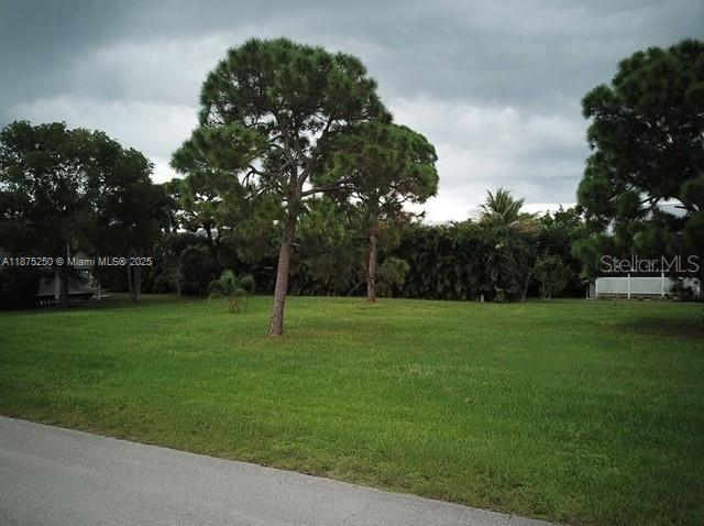 CAPITICA COVE-- one of the 2 communities in Bokeelia that has a ramp with accesses direct to the Water!Surrounded by Natural Beauty, Nestled in the tranquil community of Captain’s Cove, this buildable lot offers a rare opportunity to create your ideal island retreat. Just a short walk from the beach and embraced by lush natural surroundings, the neighborhood is celebrated for its peaceful charm and welcoming atmosphere. Uniquely positioned with road access from both the front and rear, the lot provides convenient design flexibility. Located near the heart of Pine Island, you're just minutes from local shops, dining, and amenities. Don’t miss your chance to build your dream home on this captivating slice of paradise.