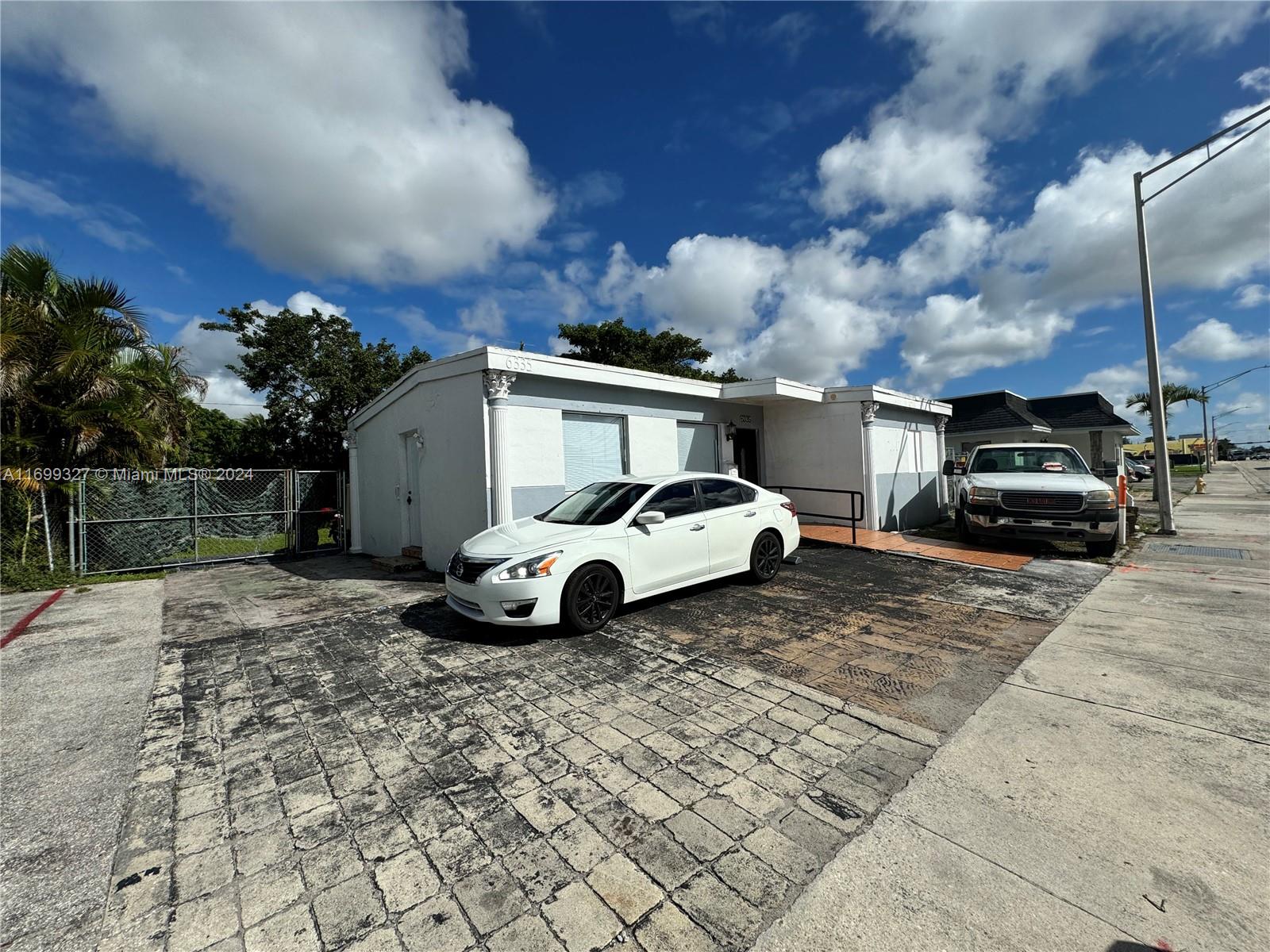 Broker LLC is pleased to present the exclusive sale of a commercial building on a prime main street in Hollywood. Currently, the property is rented as two dwelling units on a month-to-month basis, generating $1,500 and $1,800 per month, respectively. The property is zoned for moderate commercial development, allowing for a mix of retail stores, service businesses, and office spaces. It features an 815-square-foot building situated on a spacious 5,388-square-foot lot with a backyard. This is a rare opportunity to own a versatile property in a highly sought-after area. SELLER FINANCING AVAILABLE.