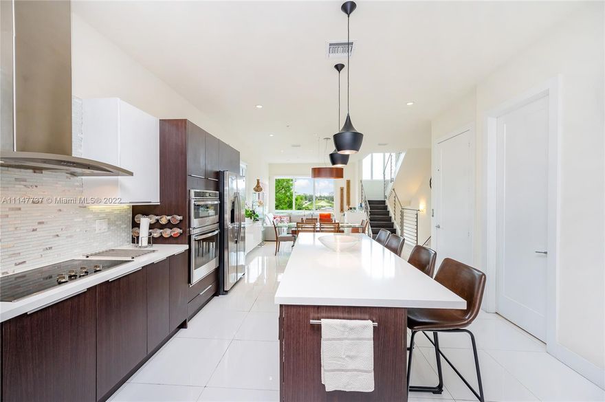 Located in luxurious Landmark at Doral community this modern and spacious corner home has 3 levels connected by an elevator. Within blocks from CityPlace Doral and Downtown Doral, you are minutes away from acclaimed restaurants, fine shops, entertainment and lively cultural venues. This home also features porcelain flooring throughout the house, spacious and modern Kitchen with quartz counter tops, stainless steel appliances, wine cooler, wall oven, and an eat-in kitchen island. It has a state of the art club house with rooftop terrace, large pool, lounging and rest area, children's area, sauna, gym, game room, tennis courts and more. Families will appreciate the proximity to A+ rated schools , such as, Doral International Math and Science Academy and Downton Doral charter schools.