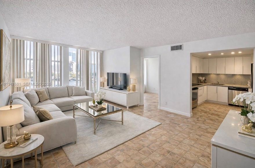 Bright, spacious, and beautifully updated, this turnkey residence offers the perfect blend of comfort and modern style in the highly desirable De Soto Condo on Three Islands Blvd. The thoughtfully renovated 1-bedroom plus den (currently converted into a second bedroom) and 1.5-bath layout is ideal for both everyday living and hosting guests.

The home features elegant tile flooring throughout, sleek stainless-steel appliances, and exceptional storage with multiple closets, including a generous walk-in closet. Natural light fills the space, creating an airy and welcoming atmosphere.

Enjoy a well-maintained, friendly community with resort-style amenities including a heated pool and tennis court. Just steps away, Joseph Scavo Park offers a playground, fitness trail, and dog park for an active lifestyle.

Unbeatable location: walk to shops, cafes, and Walmart, with the beach only minutes away. Close to Aventura Mall, top dining, and with easy access to Fort Lauderdale–Hollywood International Airport, this home offers convenience, lifestyle, and value all in one.

A must-see opportunity in the heart of Three Islands.