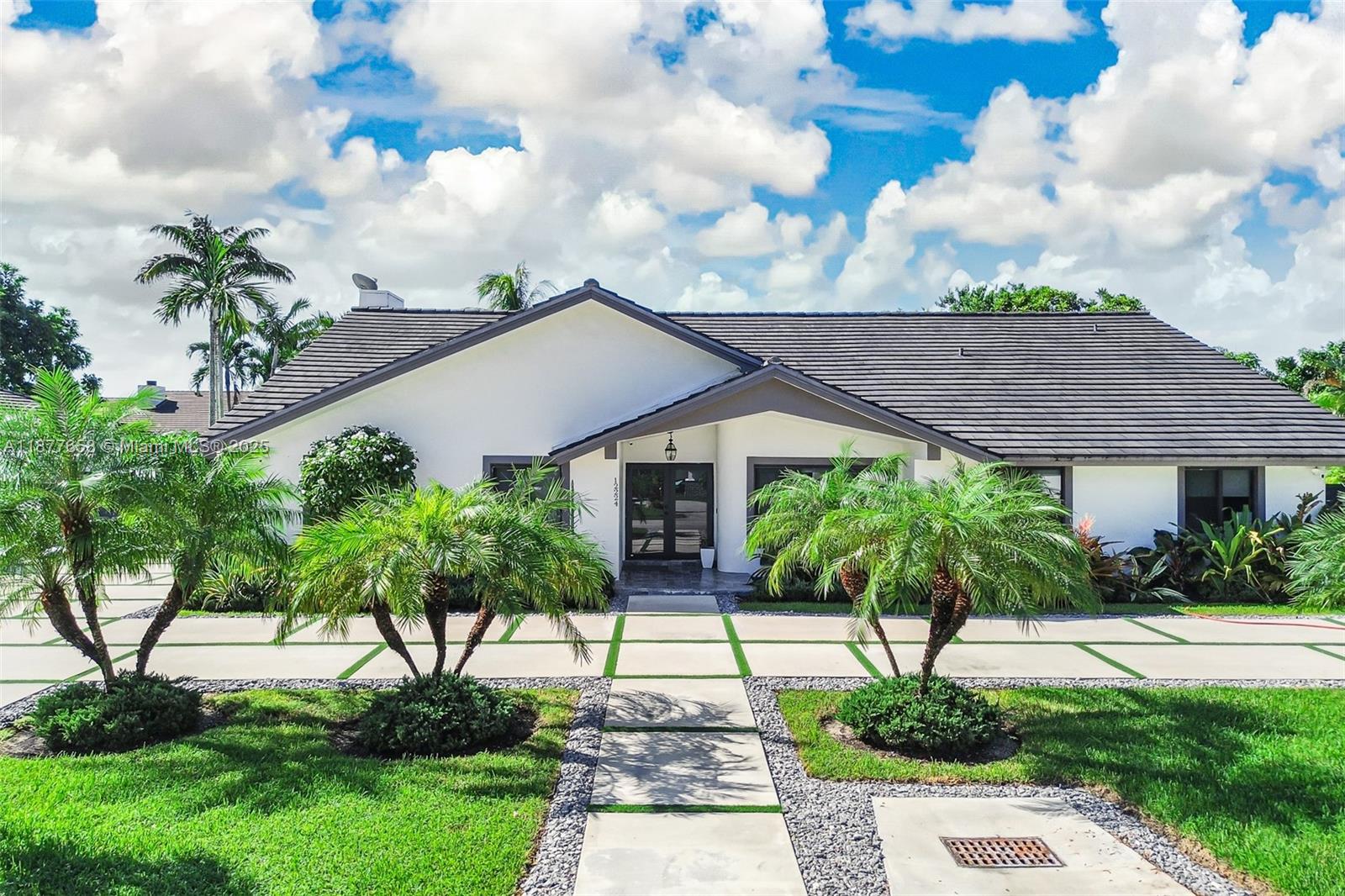 Welcome to Summit Park Estates!!!
Live the Kendall lifestyle in this updated 5 BED, 3 BATH, 3,000 sq ft home on a 15,159 sq ft lot with a 2-car garage. Entertain with ease: sparkling pool, jacuzzi, outdoor pergola, and low-maintenance artificial grass front and back. Inside, a remodeled kitchen anchors generous living areas. Peace-of-mind upgrades include impact windows and garage door (2018), roof (2018), fenced yard (2020), a permanent generator, and an electric water heater. A/C 2015 just serviced. Minutes to A-rated schools, major commerce centers, and the Turnpike—room to grow, play, and gather.
