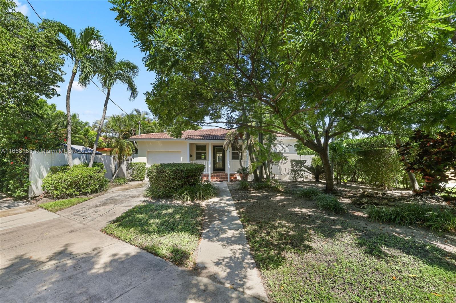 Step inside this beautiful Biscayne Point Home in Miami Beach, featuring a spacious 2 bedroom & 2 bath main house and a charming separate cottage. The main house offers an open-concept living space, the primary bedroom includes an en-suite bathroom and all rooms offer large windows for natural light.
The separate cottage comes complete with its own kitchen, bathroom and a cozy living area-ideal for extended family, guests, or a private workspace. Enjoy the serene island atmosphere, with it's own guard gate, lush landscaping, and proximity to the beach, Bal harbor shops and dining. This unique property blends comfort, style, and flexibility in one of Miami Beach's most desirable neighborhoods.