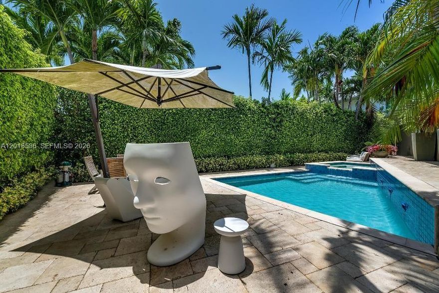 Enjoy as-is, reimagine to your vision, or seize the opportunity to build new in one of Miami Beach’s most coveted island communities. Experience the luxury of island. Set on a prime corner lot at the northern tip of the prestigious Venetian Islands, this 3-bedroom, 2-bathroom home is a private sanctuary designed for comfort and sophistication. Surrounded by lush landscaping and towering hedges, the outdoor oasis invites days spent poolside and evenings entertaining under the stars, all just moments from the beach, Sunset Harbour, and the energy of Downtown Miami.