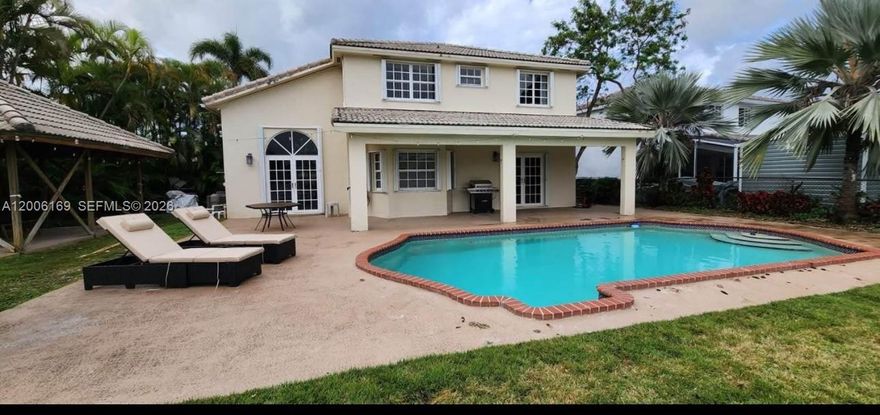 Step into a private retreat where comfort meets scenic beauty. This lakefront home offers a backyard made for relaxation and entertaining, featuring a pool, covered terrace, and spacious gazebo with stunning sunset views. Inside, enjoy 4 bedrooms, 3 bathrooms, and an open layout with lake views from the kitchen, dining, and family room. The updated kitchen includes a charming bay window perfect for morning coffee. Upstairs offers four bedrooms plus a versatile loft that can serve as a 5th bedroom or office. Situated on an oversized lot with ample parking and a 2-car garage, all just minutes from shopping, dining, and West Kendall Baptist Hospital.