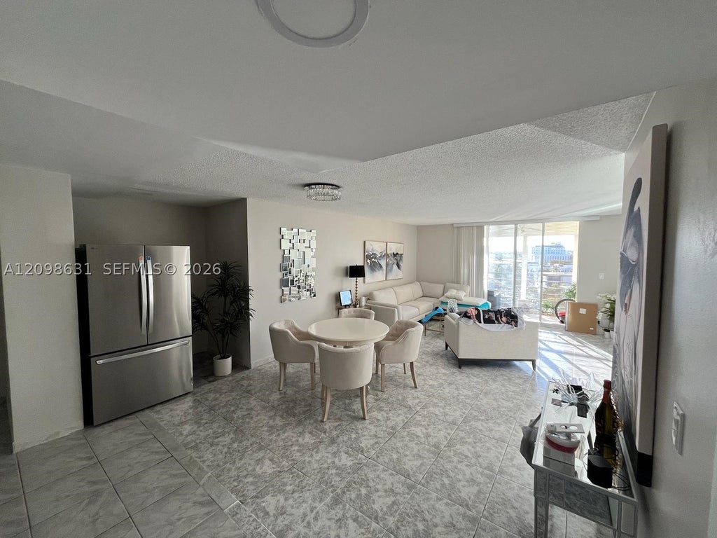 Photo of 100 Golden Isles Dr #909, Hallandale Beach, FL 33009 (MLS # A12098631)