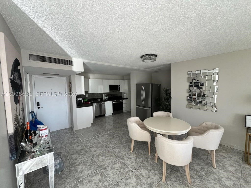 Photo of 100 Golden Isles Dr #909, Hallandale Beach, FL 33009 (MLS # A12098631)