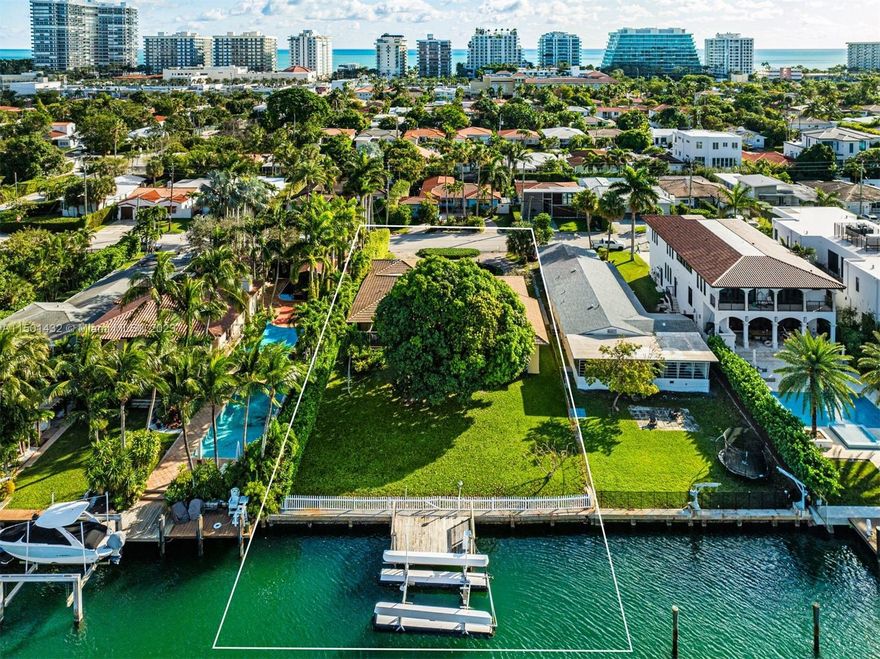 Own a piece of paradise and seize this unique opportunity to build the waterfront home you’ve always envisioned. Craft your waterfront oasis on this 13,650 square foot lot with 75 feet of water frontage. Enjoy living just minutes away from the ocean, The Surf Club Four Seasons & the renowned Bal Harbour Shops. This 4 bed/3 bath home is located on a quiet street & boasts tranquil water views throughout. Perfect opportunity to build, renovate or expand.