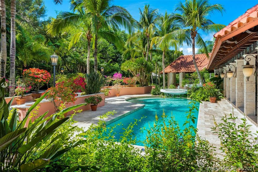 Discover paradise at this extraordinary Old Cutler garden estate! Neighboring Fairchild Gardens, this massive 7,419SF / 48,503SF Lot residence is a beauty in itself. Past the front gate, be amazed by lush grounds encircling the home & open to a stellar backyard. Fall in love w/ numerous water features, orchid gardens, massive poolside loggia, extensive terraces & optional gate access via exclusive Snapper Creek. Inside, the grandeur continues w/ a gorgeous grand white marble staircase & double-height ceilings. Spacious living/dining flow seamlessly into great chef’s kitchen, while a remarkable 2nd floor master suite offers private terrace overlooking gardens & sizable double closets. Additional offerings: 3-car garage w/ bonus loft, library & wine cellar. This home is truly one-of-a-kind!