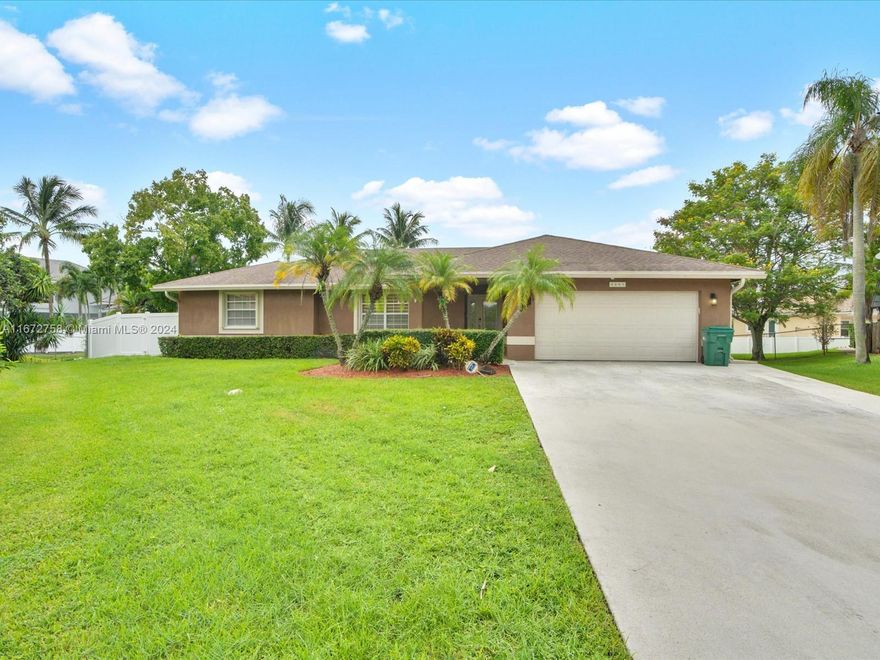 Turnkey & Move in Ready!  A Vacant single- family home Located on an oversize lot in a Cul De Sac in Plantation Acres! Beautiful 4 Bedroom 3 Bathroom home with a 2-car garage. The open-concept living area is filled with natural light, highlighting the elegant hardwood floors and contemporary finishes throughout. The kitchen boasts stainless steel appliances, and ample cabinet space, making it a chef's dream. The house is equipped with a modern fully functional trading office with two desks.  Outside, you'll find a large, well-maintained backyard, ideal for entertaining or relaxing in the Florida sunshine. The backyard is fully fenced for pets (new fences 2021) Don't miss the opportunity to make this your new home! Contact Listing agent for Showings today!