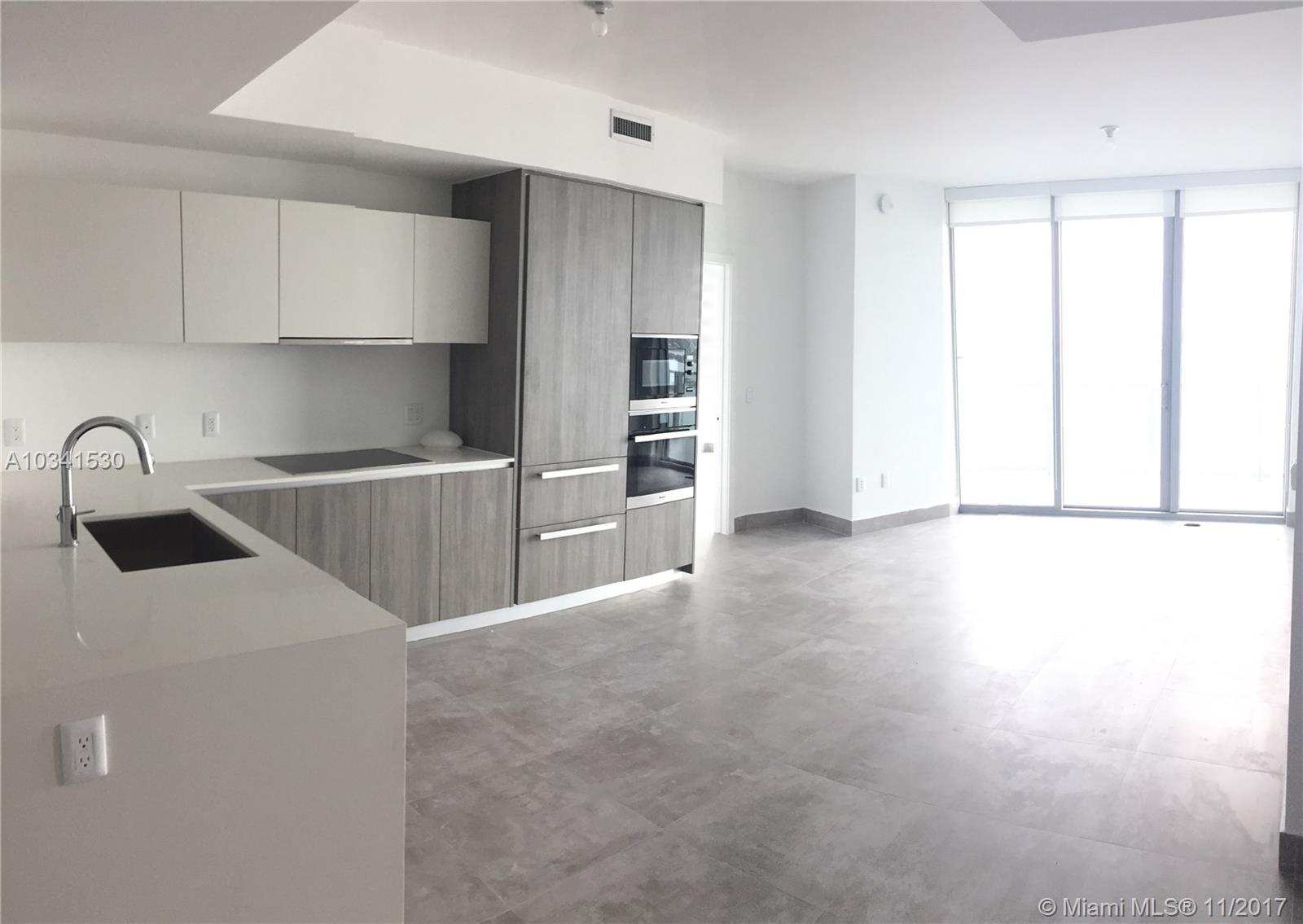 Own a 2 bed+den/3 baths in one of the highest floor in the newest building in Edgewater. Den can be transformed into a third bedroom. Unobstructed views of the bay and the ocean. Floor to ceiling windows. Brand new kitchen with top of the line appliances. Private elevator. The unit is designer ready. Amenities include pool, cabana, restaurant, gym, beach club