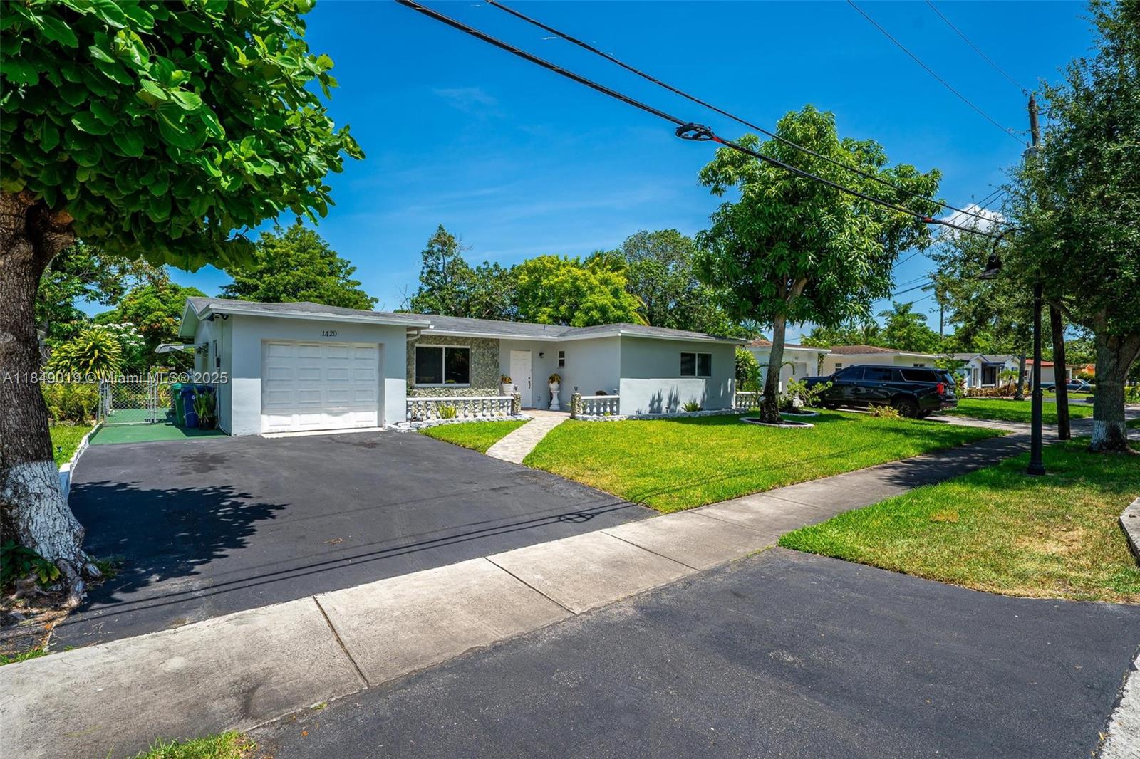 Discover comfort and style in this beautifully updated 3-bed, 2-bath home in the heart of Lauderhill. Featuring a spacious living area, separate family room, and sleek tile flooring throughout, this home offers a versatile and inviting layout. The fully renovated kitchen boasts modern finishes, while a new central A/C system and impact-rated windows and doors ensure year-round comfort, safety, and energy efficiency. Step outside to a tranquil backyard with peaceful canal views and fruit trees—ideal for relaxing or entertaining. Conveniently located near schools, shopping, parks, worship centers, and public transit, with easy access to the Turnpike, I-95, and 441. Move-in ready and perfectly positioned for South Florida living.
