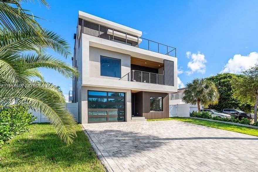 Experience the ultimate in coastal luxury living at this brand-new 3-story modern masterpiece in Pompano Beach! Just a 2-minute stroll to the beach, this 5-bed, 5-bath waterfront home offers 3,791 sq ft under AC, ~1,000 sq ft of balconies, and sweeping water views from every level. The 50-ft private dock provides direct ocean access for endless days on the water. Designed for style and function, the property features a private pool, outdoor lounge, and 1-car garage. Perfect for entertaining or relaxing, the open living spaces flow seamlessly to expansive terraces. This is coastal South Florida living at its finest — modern design, prime location, and unparalleled water access.
