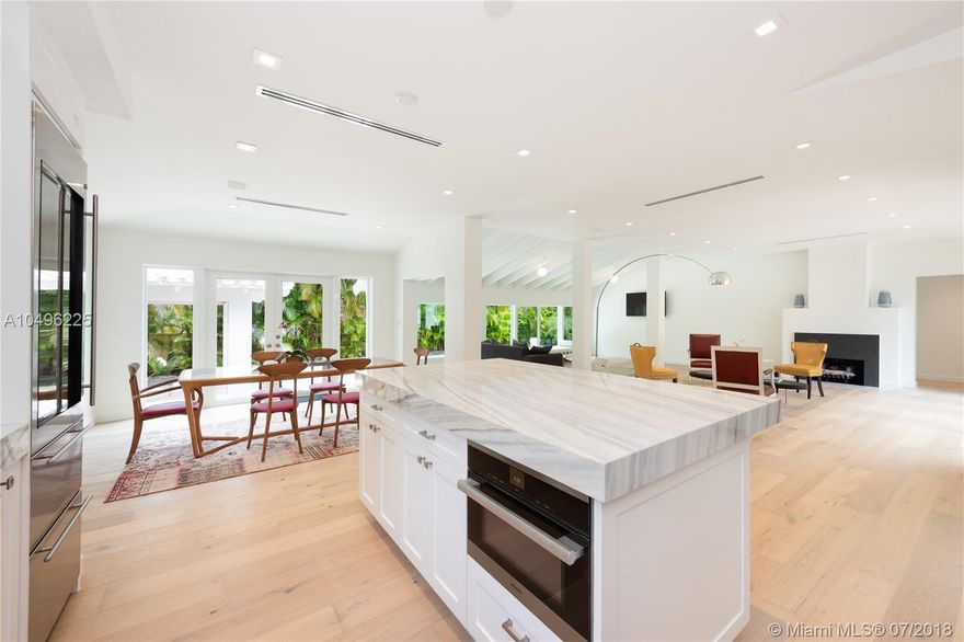 Enjoy the luxury of living on the gated & highly desirable Sunset Islands in this lush oasis. Full renovation completed in 2018, spectacular smart home situated on 13,800 sf lot features an open, airy floor plan, 3,282 adj sf, & bleached French Oak floors throughout. Gourmet kitchen features top of the line Wolf & Miele appliances, wine fridge & marble countertops. The open living/dining area perfect for entertaining offers abundant natural light. Unwind in the master suite with views of the sparkling pool, large walk-in closet & spa-like bathroom, his & hers vanities, separate shower & soaking tub. Entertain outdoors in your private backyard w/ heated saltwater pool & cabana area. Other features include hurricane impact glass windows and doors, Sonos sound system, NEST A/C & Ring doorbell