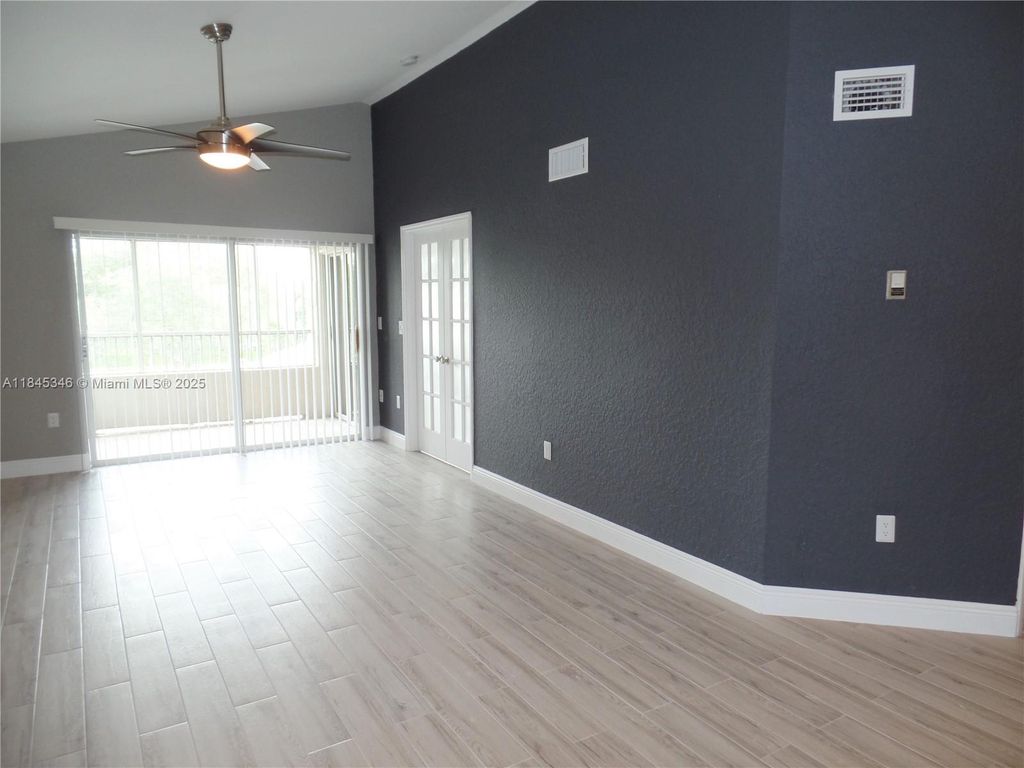 Photo of 2803 N Oakland Forest Dr #303, Oakland Park, FL 33309 (MLS # A11845346)