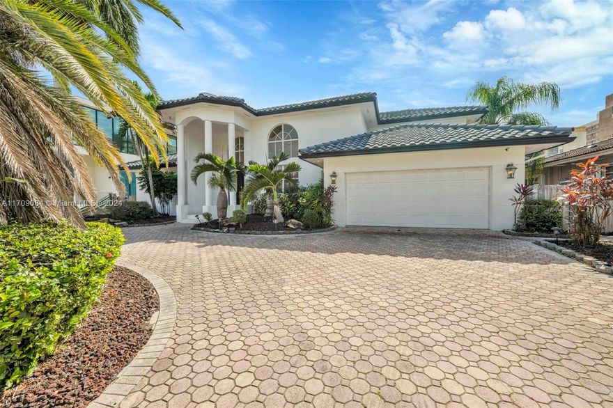 Welcome to this stunning 5-bedroom, 4-bathroom waterfront masterpiece in the prestigious, guard-gated community of Eastern Shores. With direct ocean access and no fixed bridges, this property offers the ultimate in luxury and convenience for boating enthusiasts, featuring a private dock capable of accommodating an 80-foot yacht and a Wave runner elevator lift for added water sport enjoyment. Designed with modern elegance, this home boasts soaring high ceilings, exquisite marble flooring, and premium granite countertops throughout. Hurricane-impact windows ensure safety and peace of mind, while the home is also equipped with 4 separate A/C zones, a heated pool, and a relaxing spa to elevate your living experience.